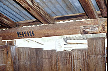 The year of repair marked on a new beam with wool-bale stencils