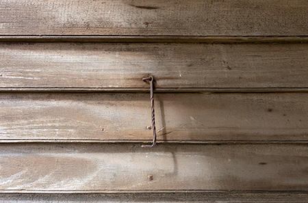 beaded weatherboards and wrought iron cabin hook